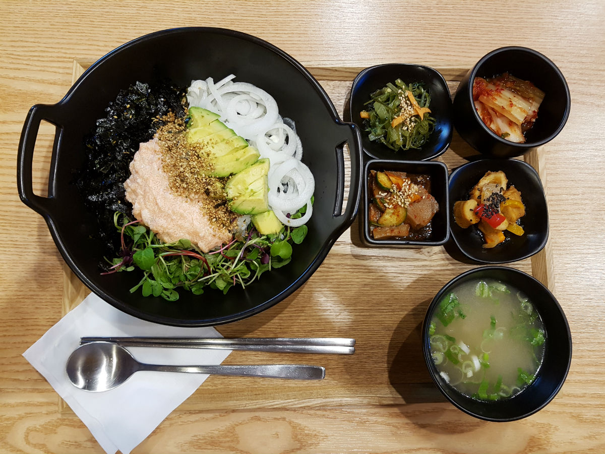 The meal - A bowl of rice topped with walleye pollock roe, avocado, onion and vegetables